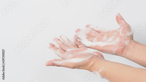 Washing hand with soap foam wipe for prevention and hygiene on white background.