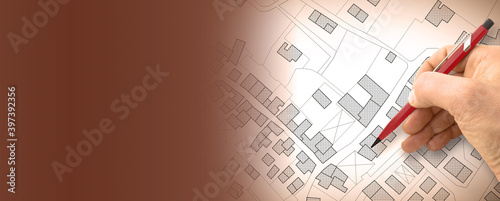 Imaginary cadastral map of territory with buildings, roads and land parcel - concept illustration with copy space on colored background photo