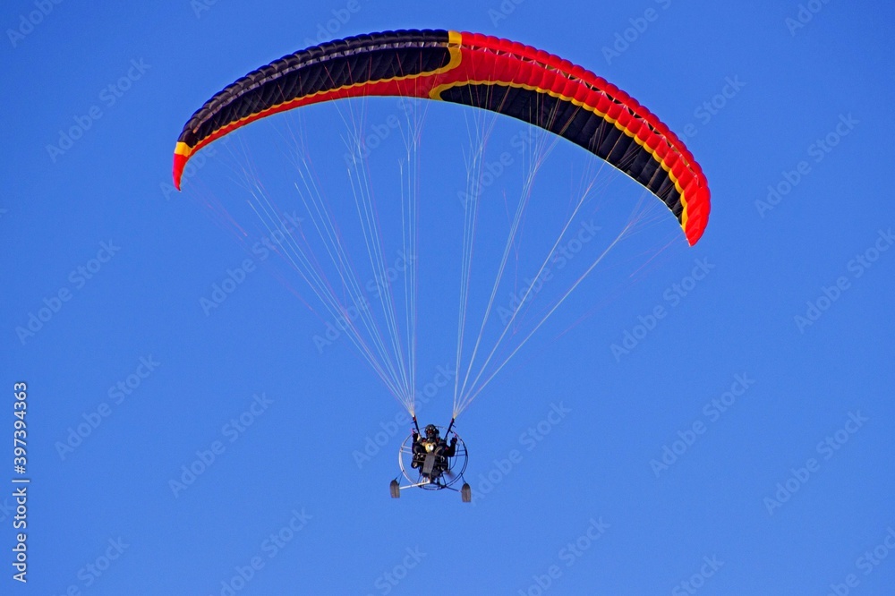 Paragliding against a bright blue sky. Hobby. Sport. Paragliding against a bright blue sky. Hobby. Sport.