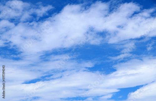 Blue sky background with clouds, White clouds floating on blue sky for backgrounds concept