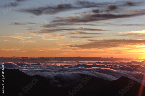 a sunset over a mountain range © kingmauri