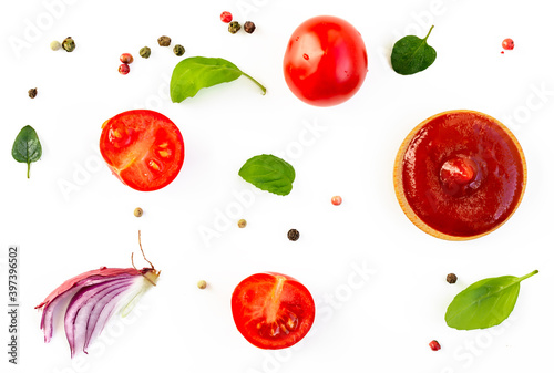 Ketchup or tomato sauce ingredients on white background, top view