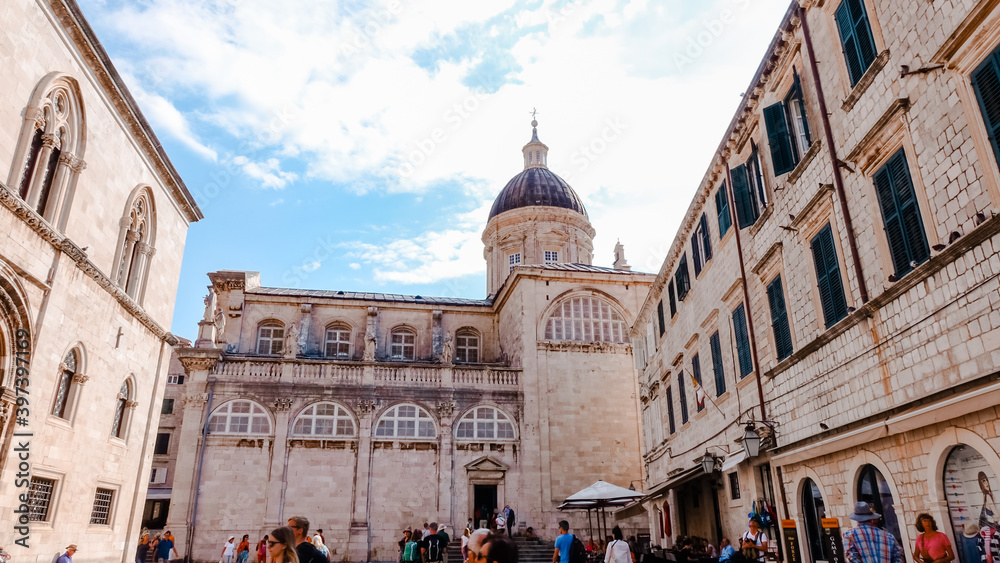 Dome of Dubrovnik Cathedral. Low angle view of Dubrovnik Cathedral and its dome with people