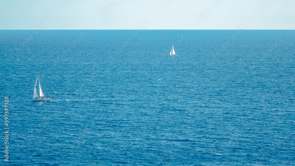 Two Sailing boats in the Adriatic Sea. Blue Adriatic sea with two sailing boats shot in Dubrovnik Croatia