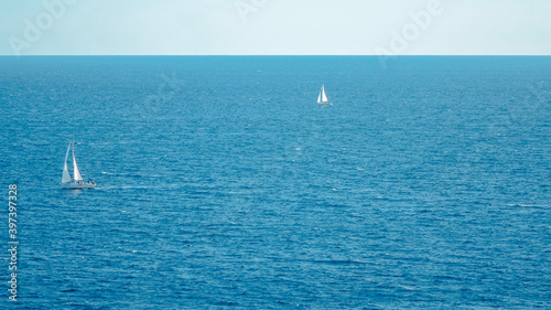 Two Sailing boats in the Adriatic Sea. Blue Adriatic sea with two sailing boats shot in Dubrovnik Croatia