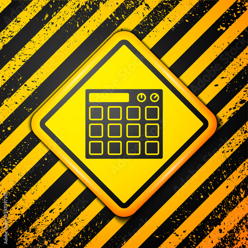 Black Drum machine music producer equipment icon isolated on yellow background. Warning sign. Vector.