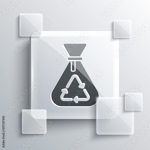 Grey Garbage bag with recycle symbol icon isolated on grey background. Trash can icon. Recycle basket sign. Square glass panels. Vector.