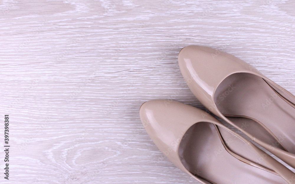 Beige women's shoes on a light background. Women's shoes with heels Beige women's shoes on a light background. Women's shoes with heels
