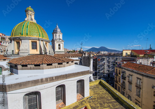 Naples, Italy - located over the Catacombs of San Gaudioso, the Church of Santa Maria della Sanità  is very recognizable for its green dome and Mount Vesuvius on the background photo