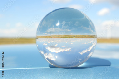 Summer landscape inside the glass globe