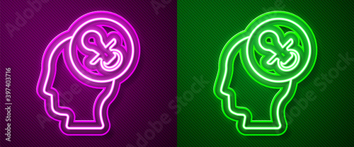 Glowing neon line Baby dummy pacifier icon isolated on purple and green background. Toy of a child. Vector.