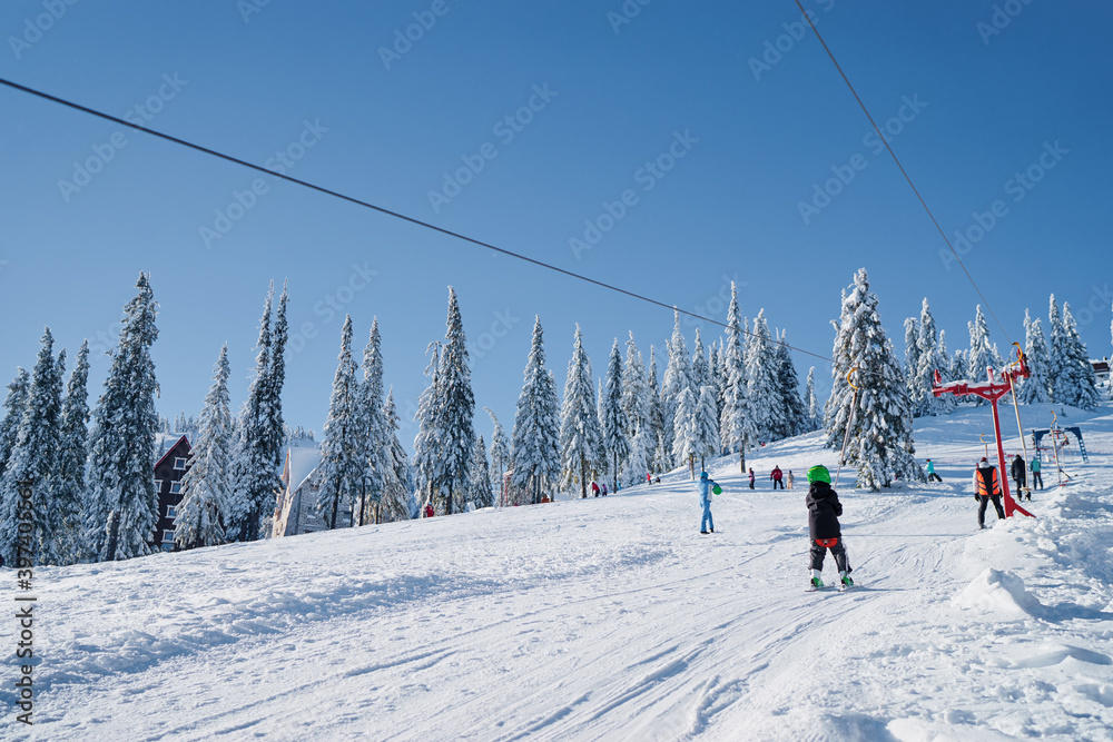 Skiing area in Ukrainian Carpathian in the morning light. Beautiful winter landscape. Nature and sport. Skiing area in Ukrainian Carpathian in the morning light. Beautiful winter landscape. Nature and sport.
