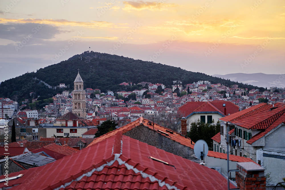 Beautiful sunset cityscape with red tiled roofs of Split old town, Croatia.