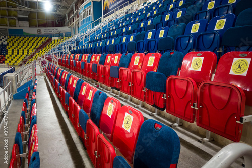 locked chairs at the stadium during the pandemic keep your distance don't sit here