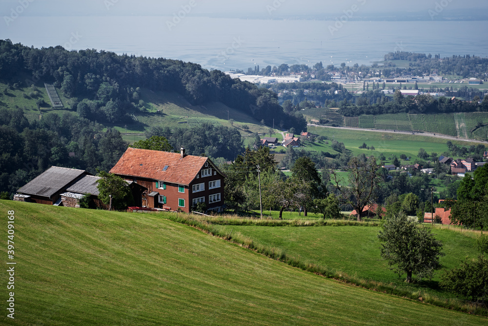 Obraz premium Alpine mountains landscape. Traditional farm house with wonderfull view.