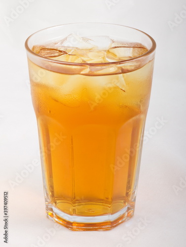 Apple juice with ice cubes in a glass Cup