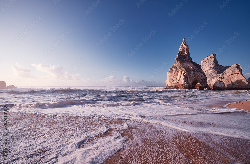 Cliffs and rocks on the Atlantic ocean coast - Praia da Ursa beach, Portugal.