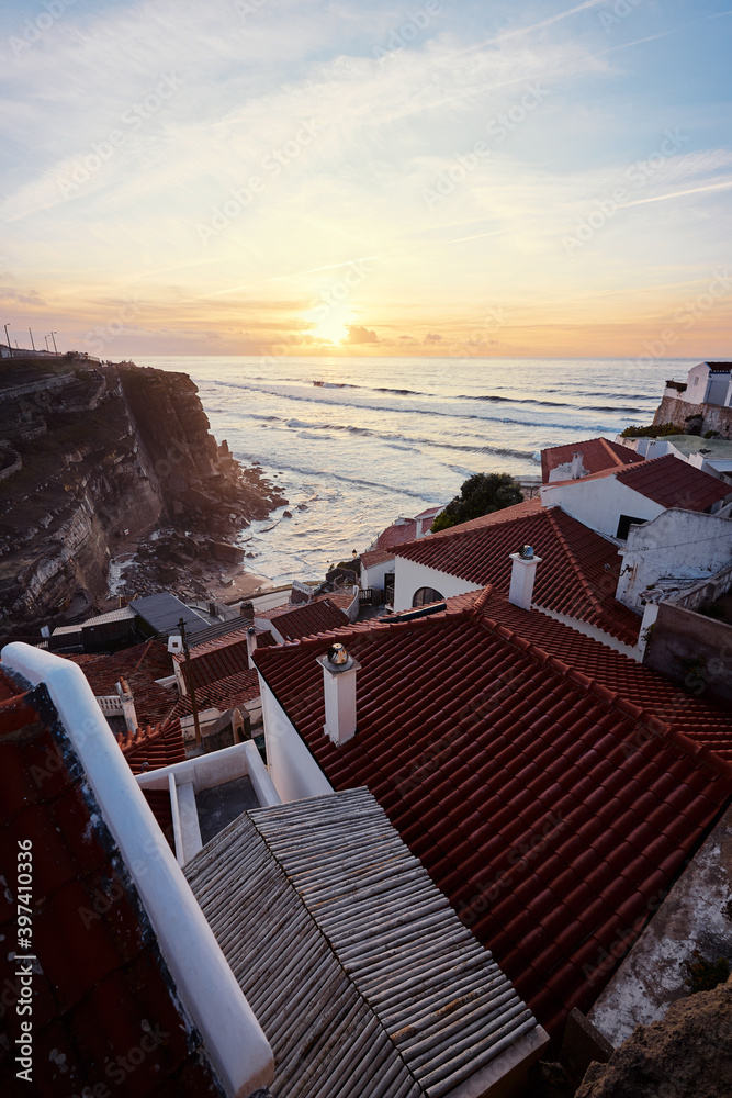 Beautiful sunset on Atlantic Ocean. View from Azenhas do Mar, a tiny coastal town near Sintra, Lisbon, Portugal.
