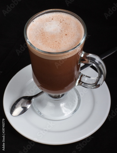 Hot chocolate in a clear glass glass