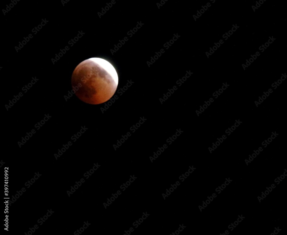 evocative image of moon eclipse at night
evocative image of moon eclipse at night