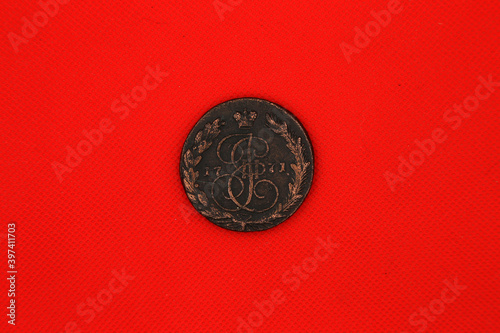 Vintage russian copper coin on red background