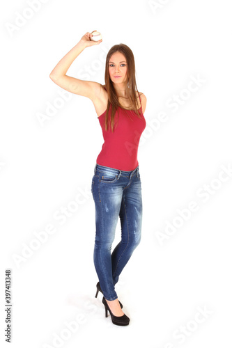 Young woman is throwing baseball isolated white background