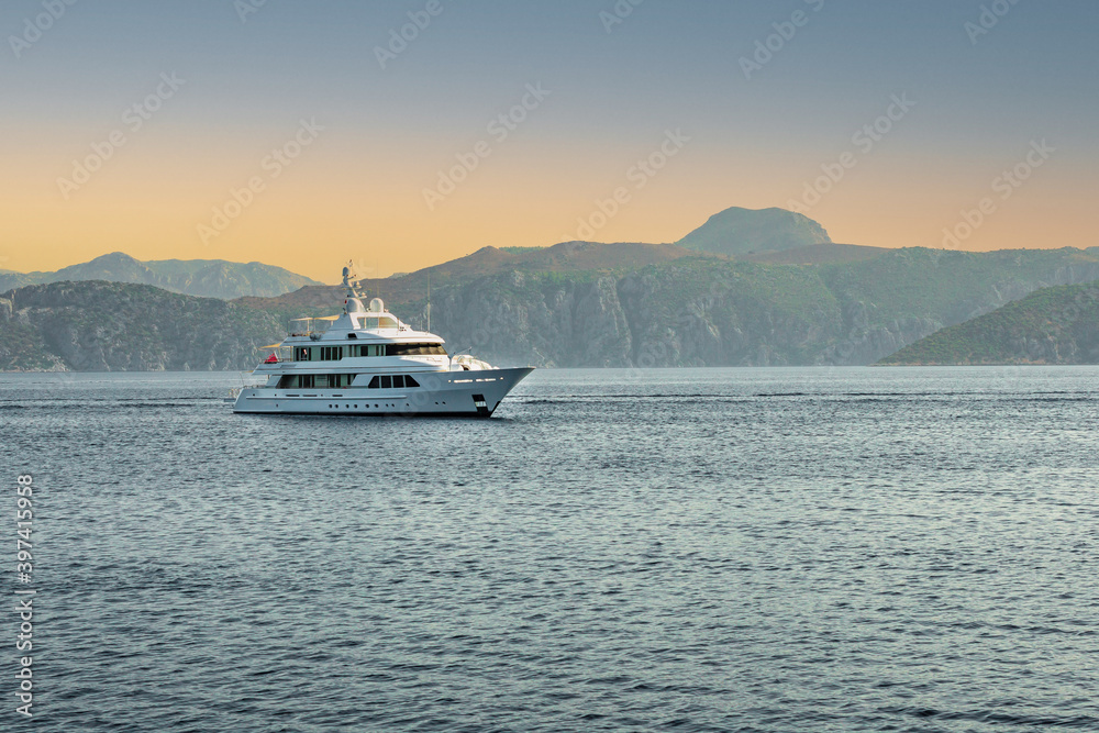 seascape with yacht. Seascape with Boats and Yacht on the Mediterranean Bay of Marmaris, Turkey. white yacht stands on the shore of the turquoise Mediterranean Sea.