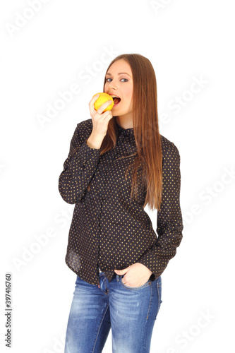 Young woman is biting a quince isolated white background