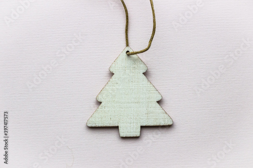 decorative wooden Christmas tree on a light background