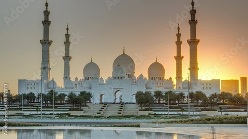 Sheikh Zayed Grand Mosque in Abu Dhabi at sunset timelapse, UAE. Evening view from Wahat Al Karama photo
