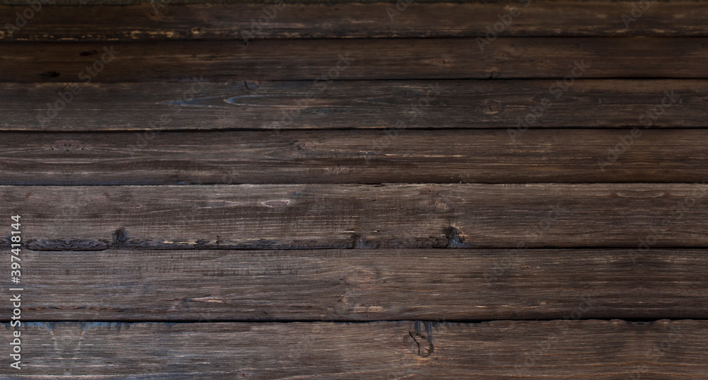 Brown wood background. Old rough boards. Fence Brown wood background. Old rough boards. Fence