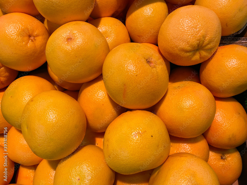 Close up of isolated group ripe raw yellow grapefruits on german market Close up of isolated group ripe raw yellow grapefruits on german market