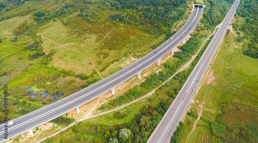 Aerial view of A1 Transylvania Highway between Sibiu and Sebes with spectacular viaduct bridge and passage route, roads of Romania