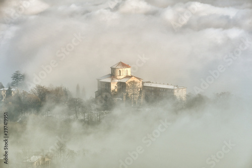 The Sanctuary of Graglia shrouded in fog and snow