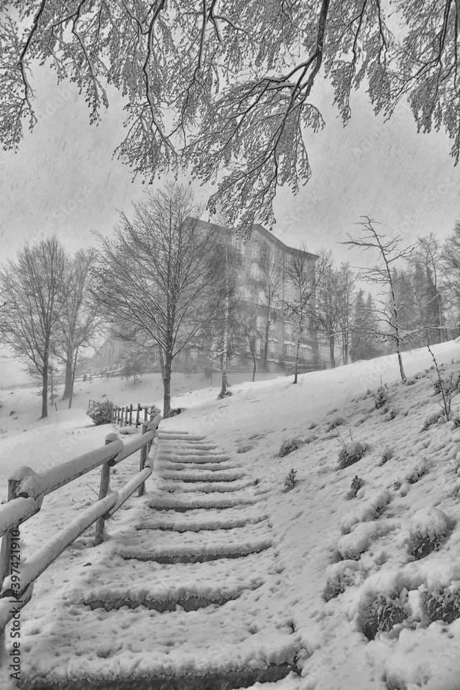 The Sanctuary of Graglia shrouded in fog and snow