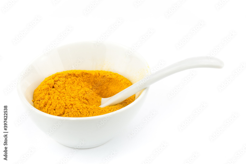 Bowl filled with turmeric powder Bowl filled with turmeric powder