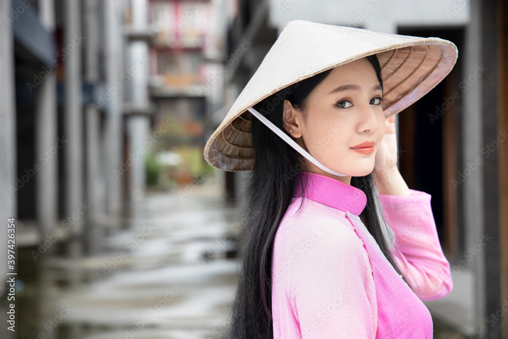 Happy smiling Vietnamese girl; portrait of exotic asian Vietnam