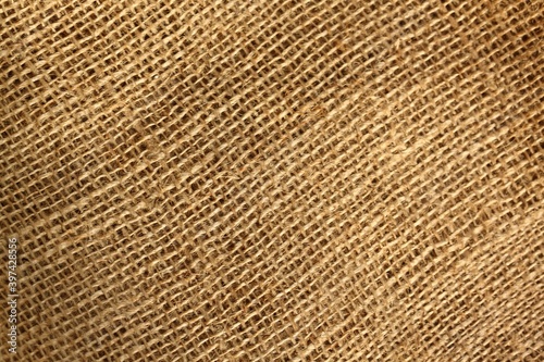 Sackcloth burlap woven texture background. Burlap background and texture with interesting light.