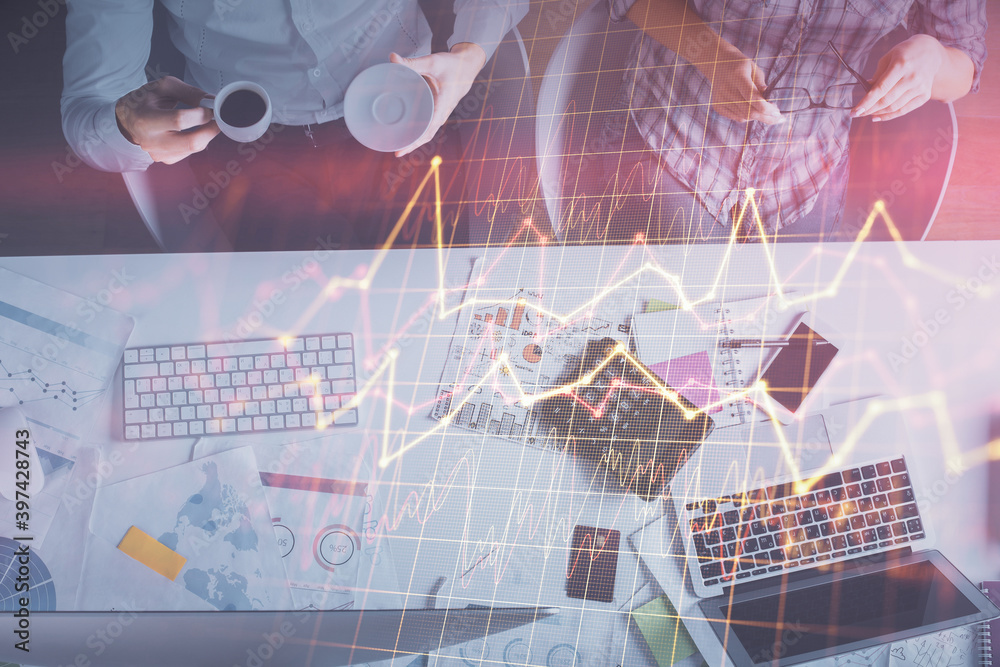 Double exposure of man and woman working together and financial chart hologram drawing. market analysis concept. Computer background. Top View. Double exposure of man and woman working together and financial chart hologram drawing. market analysis concept. Computer background. Top View.