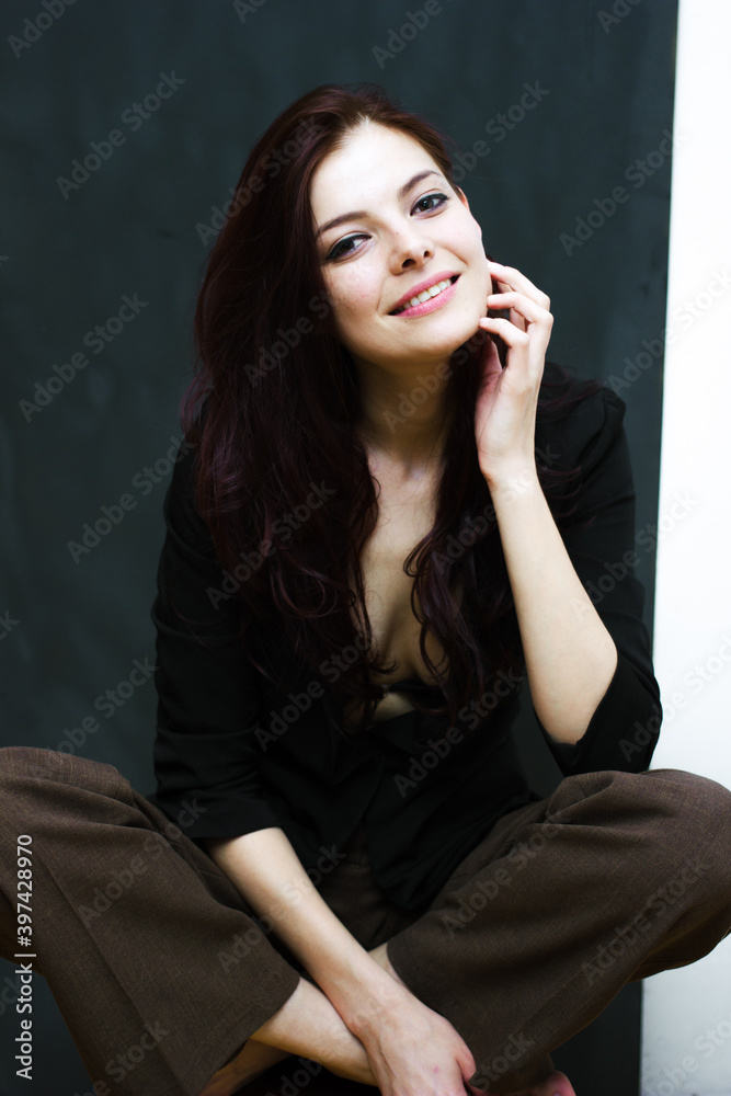 Portrait of a young happy woman isolated on a blackboard. Portrait of a young happy woman isolated on a blackboard.