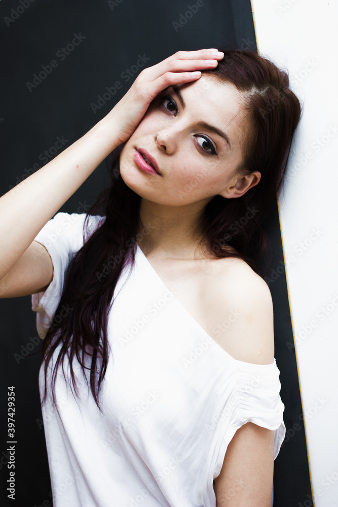 Portrait of a young happy woman isolated on a blackboard.