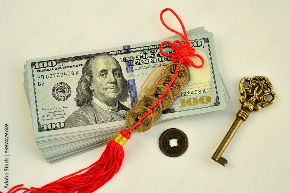 Ταπετσαρία A bundle of 100 dollar bills, a key, and сhinese feng shui coins  talismans to a