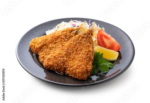 Fried horse mackerel served on a plate on a white background