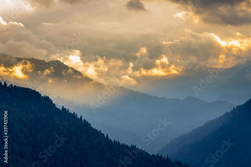 Beautiful mountain landscape at Caucasus mountains with clouds and blue sky