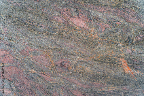 Dark grainy marble with multicoloured wave patterns. High quality texture and background for your projects and creative work