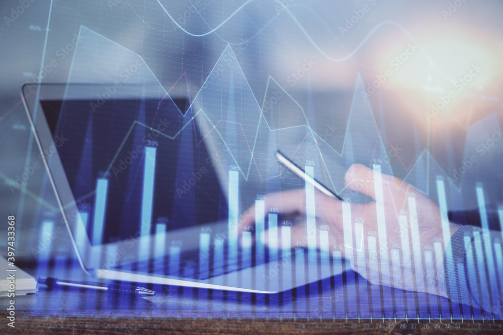 Double exposure of man's hands holding and using a digital device and forex graph drawing. Financial market concept. Double exposure of man's hands holding and using a digital device and forex graph drawing. Financial market concept.