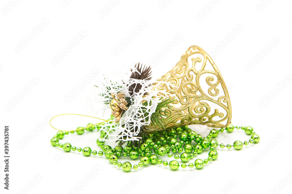 Fototapeta premium Christmas decoration in the form of a garland and golden Christmas bell isolated on a white background. Christmas tree toy. New year background.