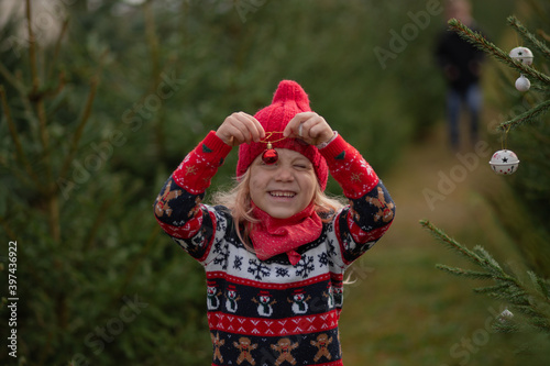 girl with long blond hair in the woods Christmas tree