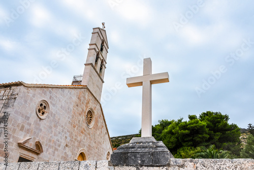 Christian cross on the waterfront of Vis island, Croatia