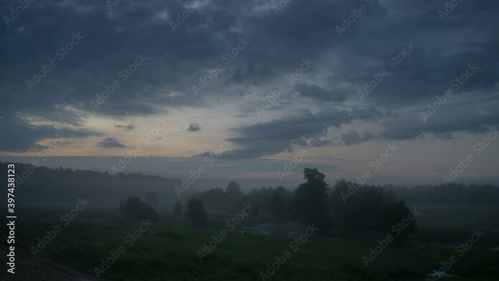 Foggy cold sunrise over a meadow and river floodplain with spectacular clouds. Foggy cold sunrise over a meadow and river floodplain with spectacular clouds.